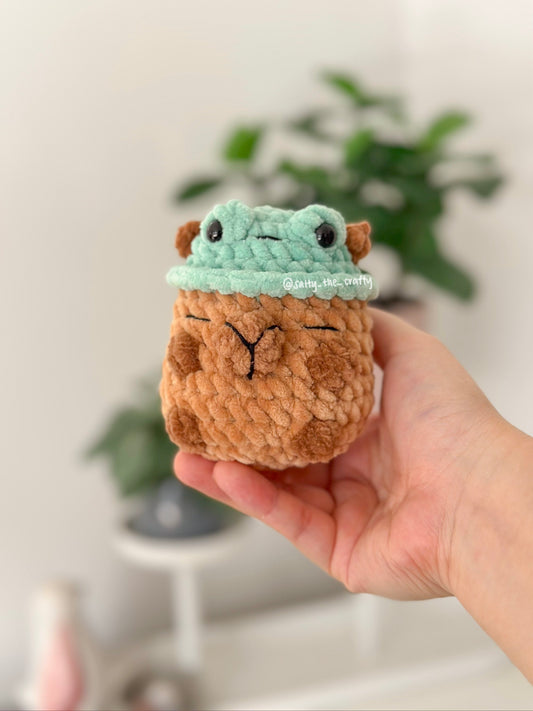 sitting capybara (duck hat)
